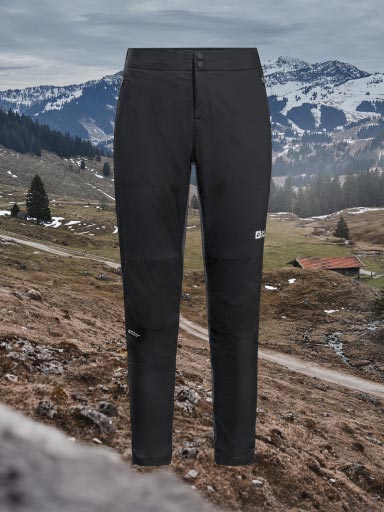 A pair of cycle shorts with braces and the countryside in the background